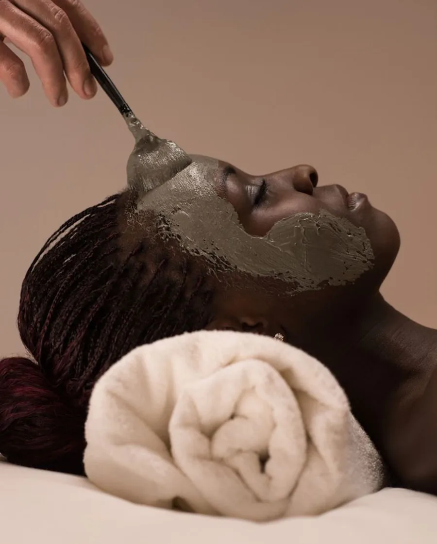 A clay mask being applied during a neoSKiN facial