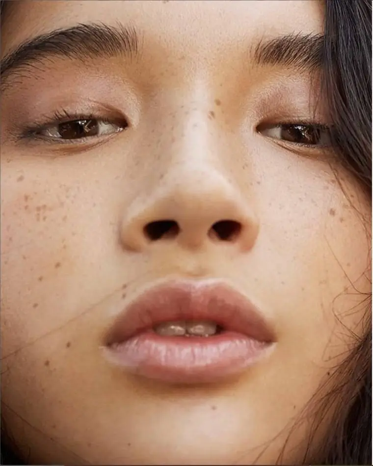 Close portrait showing naturally defined microbladed brows