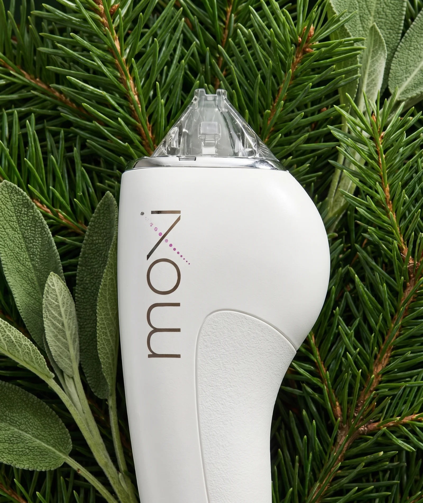 MOXI laser handpiece among botanical foliage