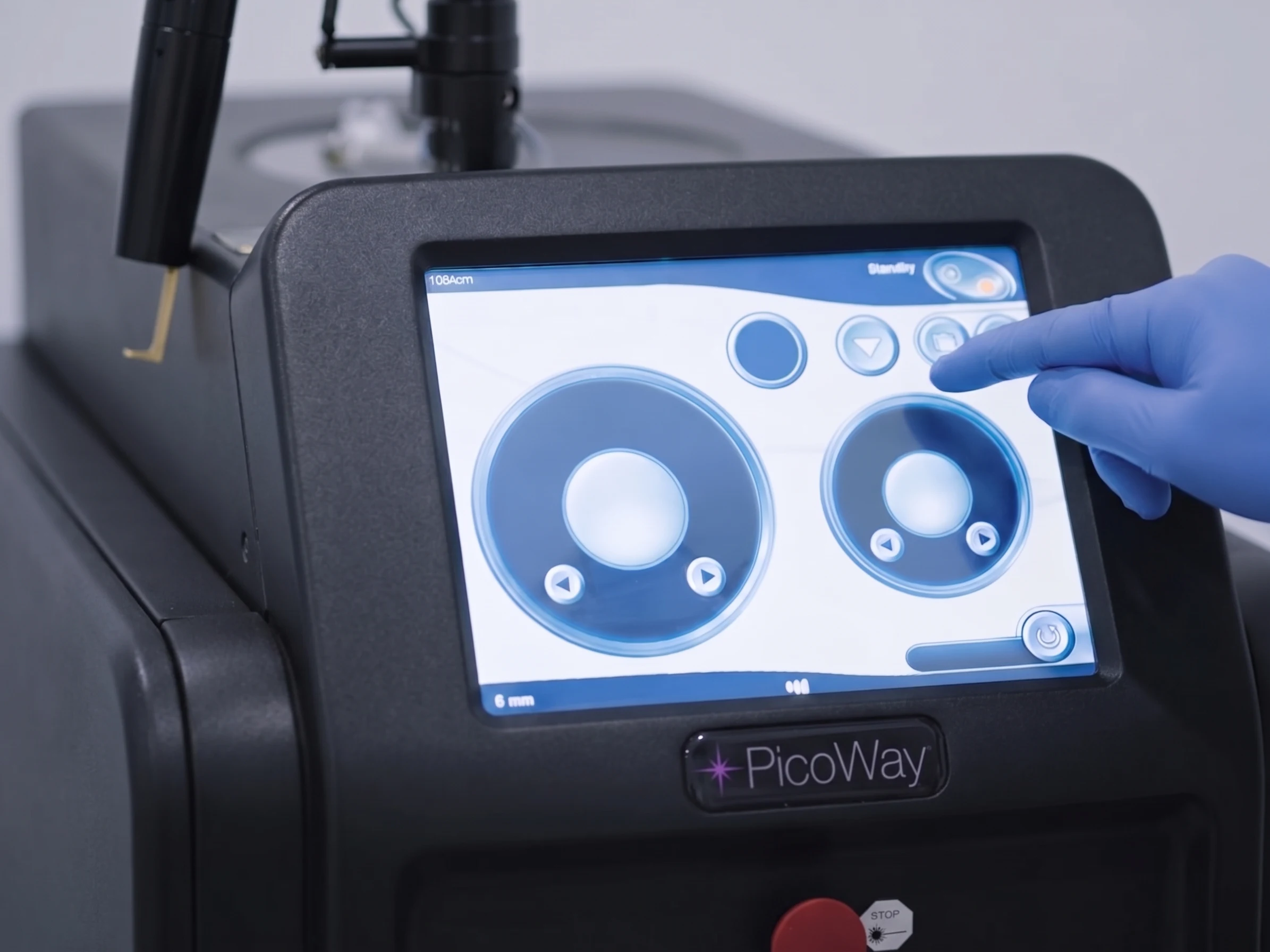 Clinician adjusting settings on the PicoWay laser console
