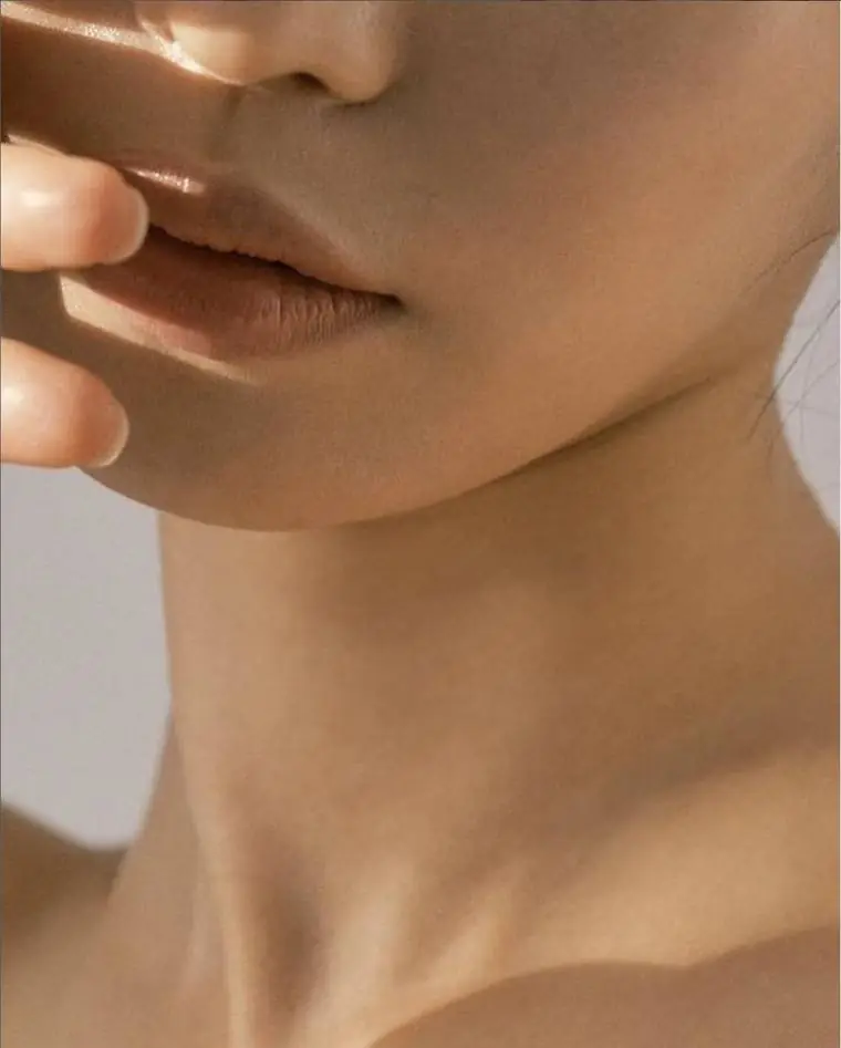 Jawline and neck in warm natural light